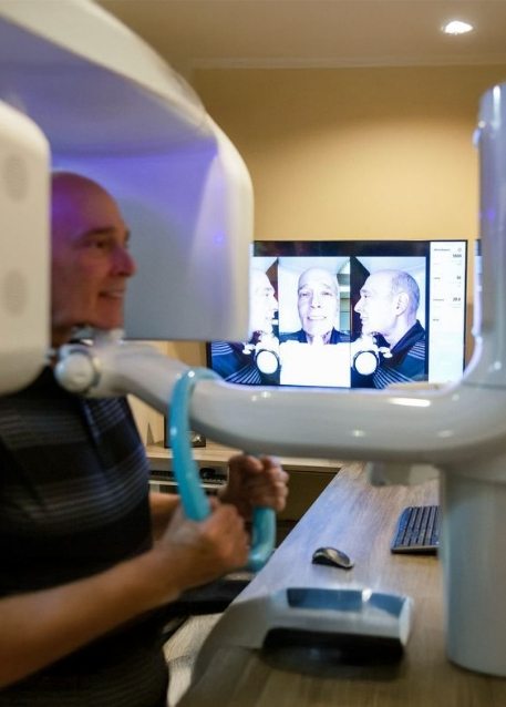 Dental patient getting a cone beam scan of his mouth and jaw