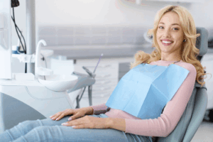 a dental patient smiling while seated 